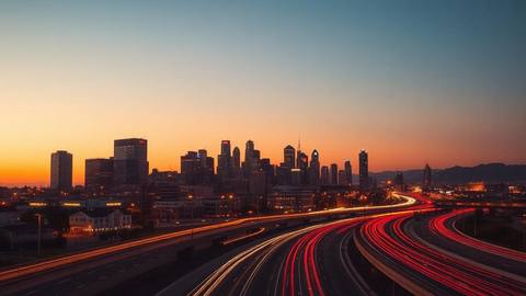 Southern city skyline at dusk with highway traffic