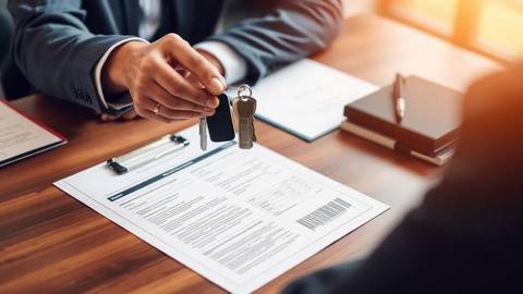 Car keys resting on vehicle title paperwork at a lending desk
